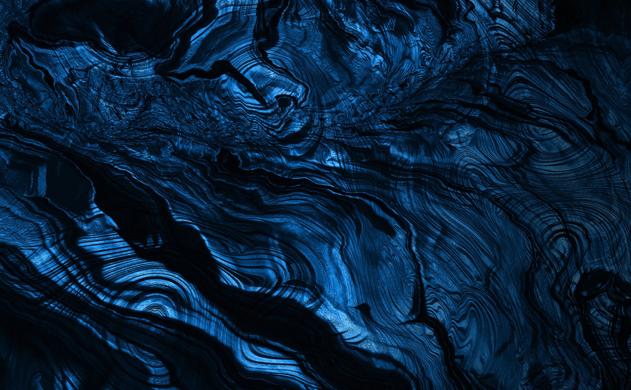 Blue abstract wave patterns with smooth texture.