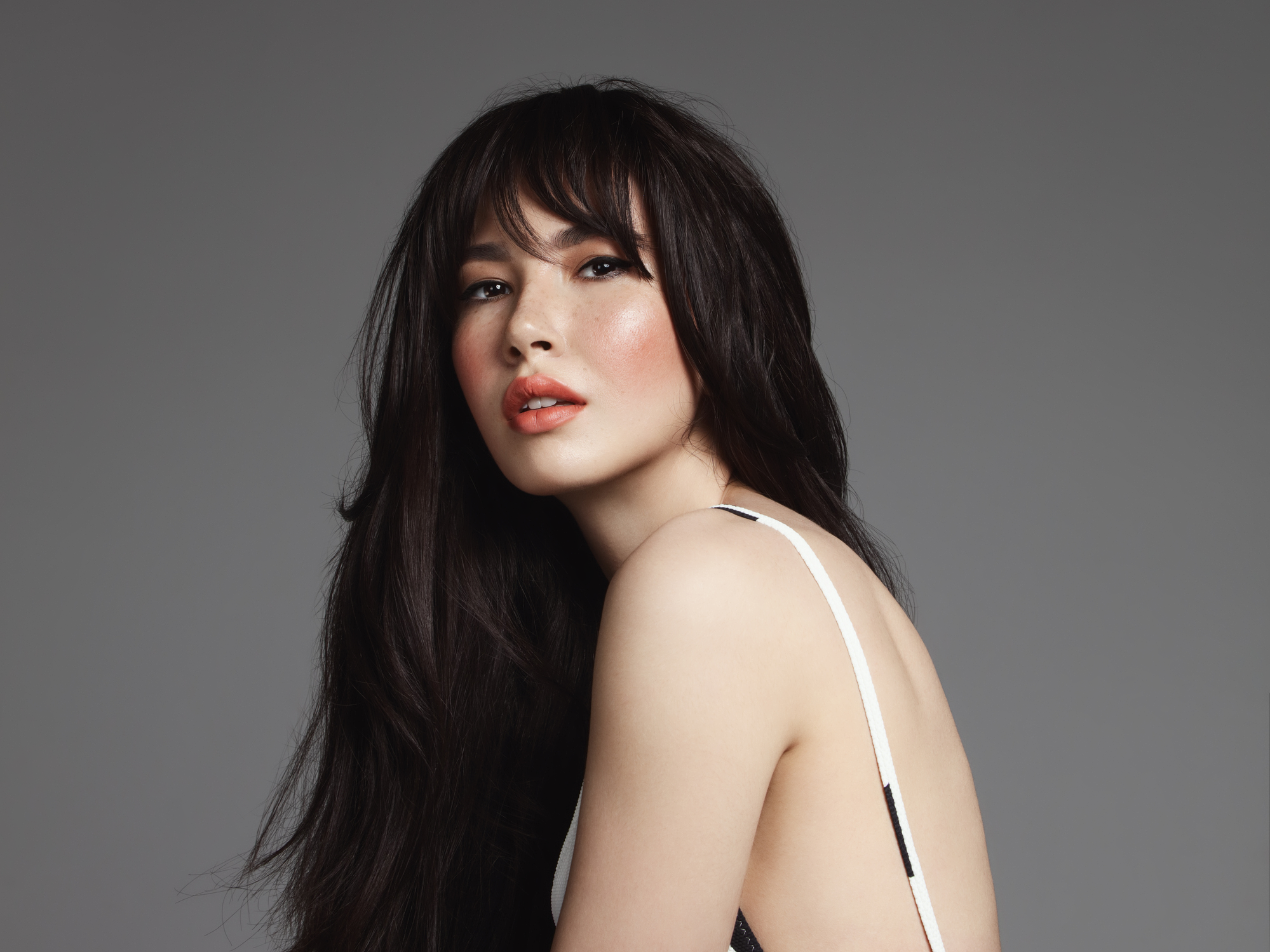 Portrait of a woman with long, dark hair.